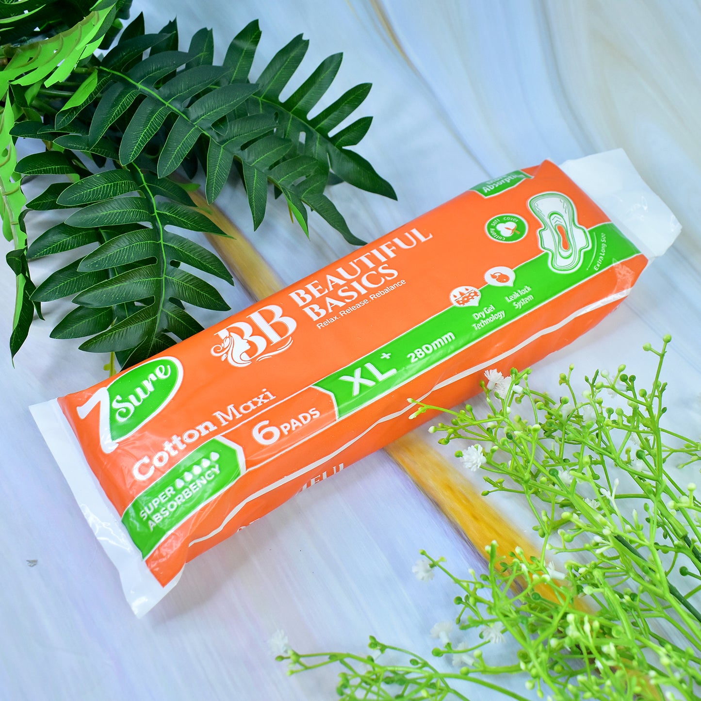 Six orange cotton maxi sanitary pads by Wukusy, XL+ 280mm, displayed in a pack for women's health care.