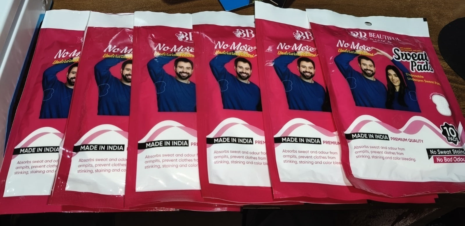 Wukusy Beautiful Basics disposable underarm sweat pads, 6 packs of 60, for odor and moisture absorption in health care.