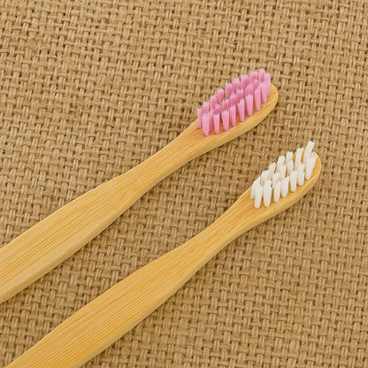 Two Wukusy eco-friendly bamboo toothbrushes with medium bristles, natural wood finish, and soft bristle heads for oral care.