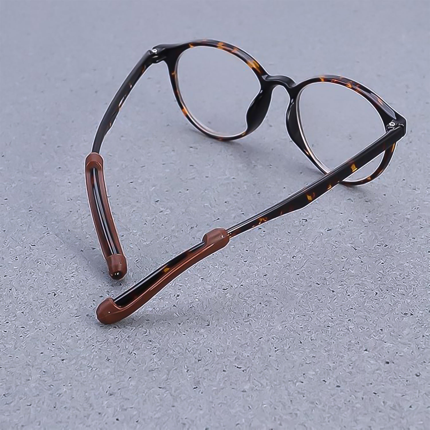 Wukusy soft silicone eyeglass anti-slip ear grips, one pair, designed to secure glasses comfortably with color may vary.