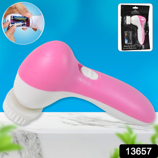 Wukusy facial beauty brush face massager with 2 AA batteries, handheld health care device for skin cleansing and rejuvenation.