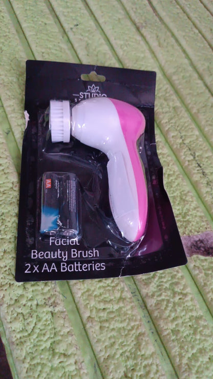 Wukusy facial beauty brush face massager with handle, powered by 2 AA batteries, for skincare and facial cleansing.