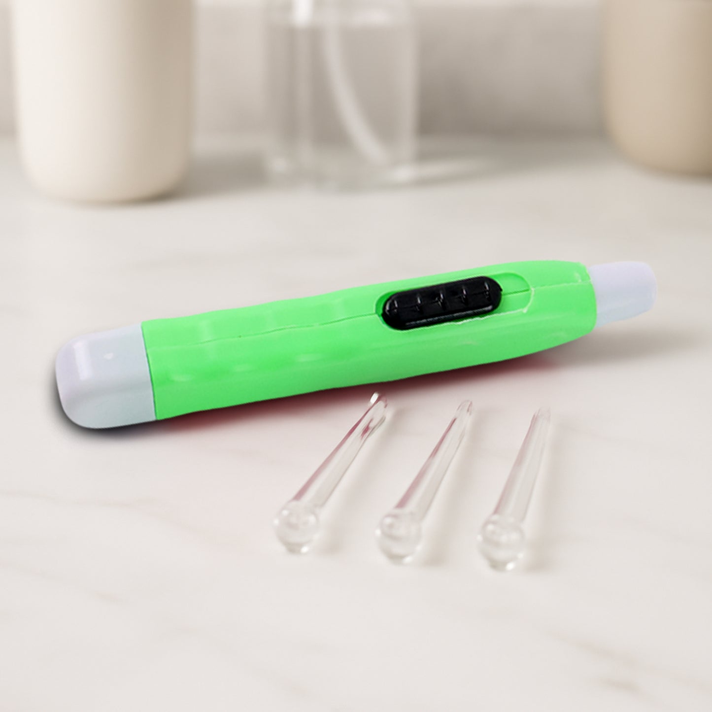Green LED flashlight earpick with tweezer, Wukusy health care tool for ear cleaning, showing the device with LED light and tweezer tip.