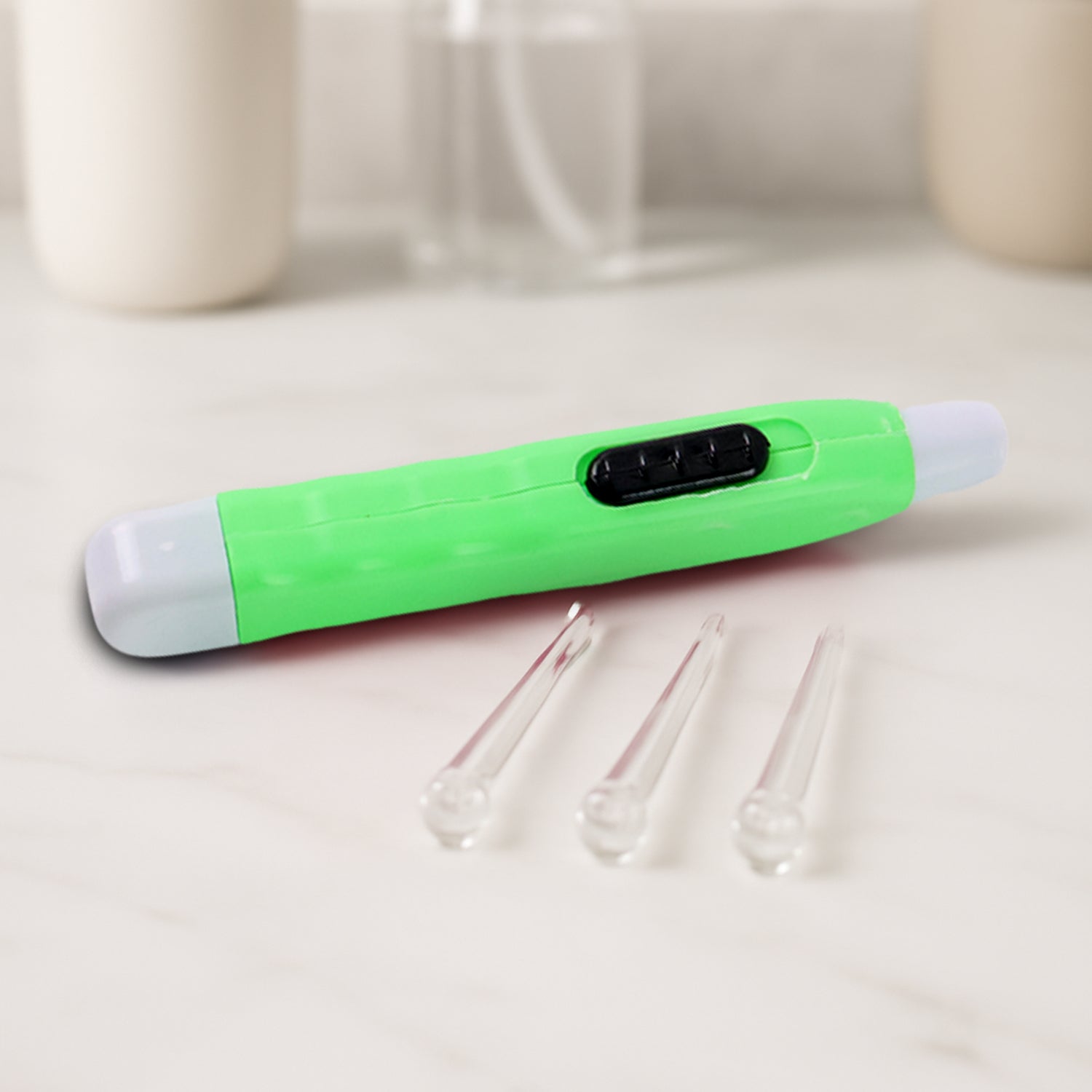 Green LED flashlight earpick with tweezer, Wukusy health care tool for ear cleaning, showing the device with LED light and tweezer tip.