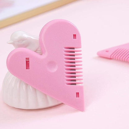 Heart-shaped plastic hair cutting scissors from Wukusy, single piece with card packaging, designed for health care use.