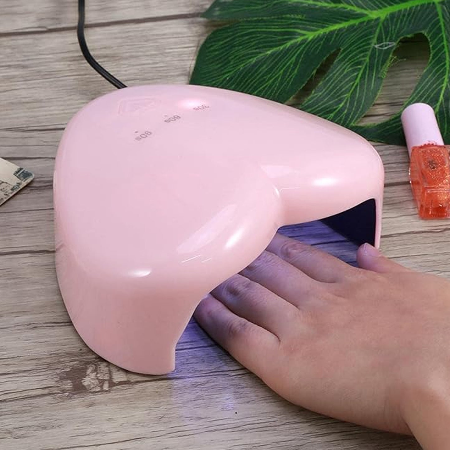 Wukusy LED UV nail dryer lamp for curing gel nail polish, featuring a mix of designs, suitable for professional or home use.