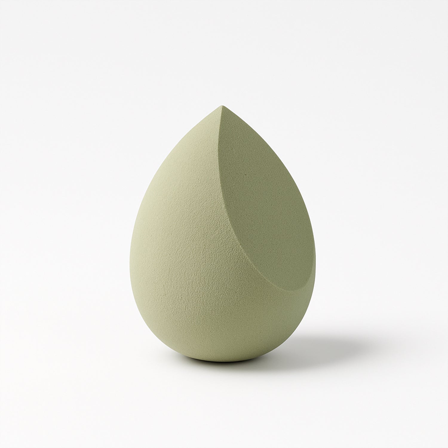 Multicolor Wukusy makeup sponge for blending liquid foundations, powders, and creams, shown in close-up on a white background.
