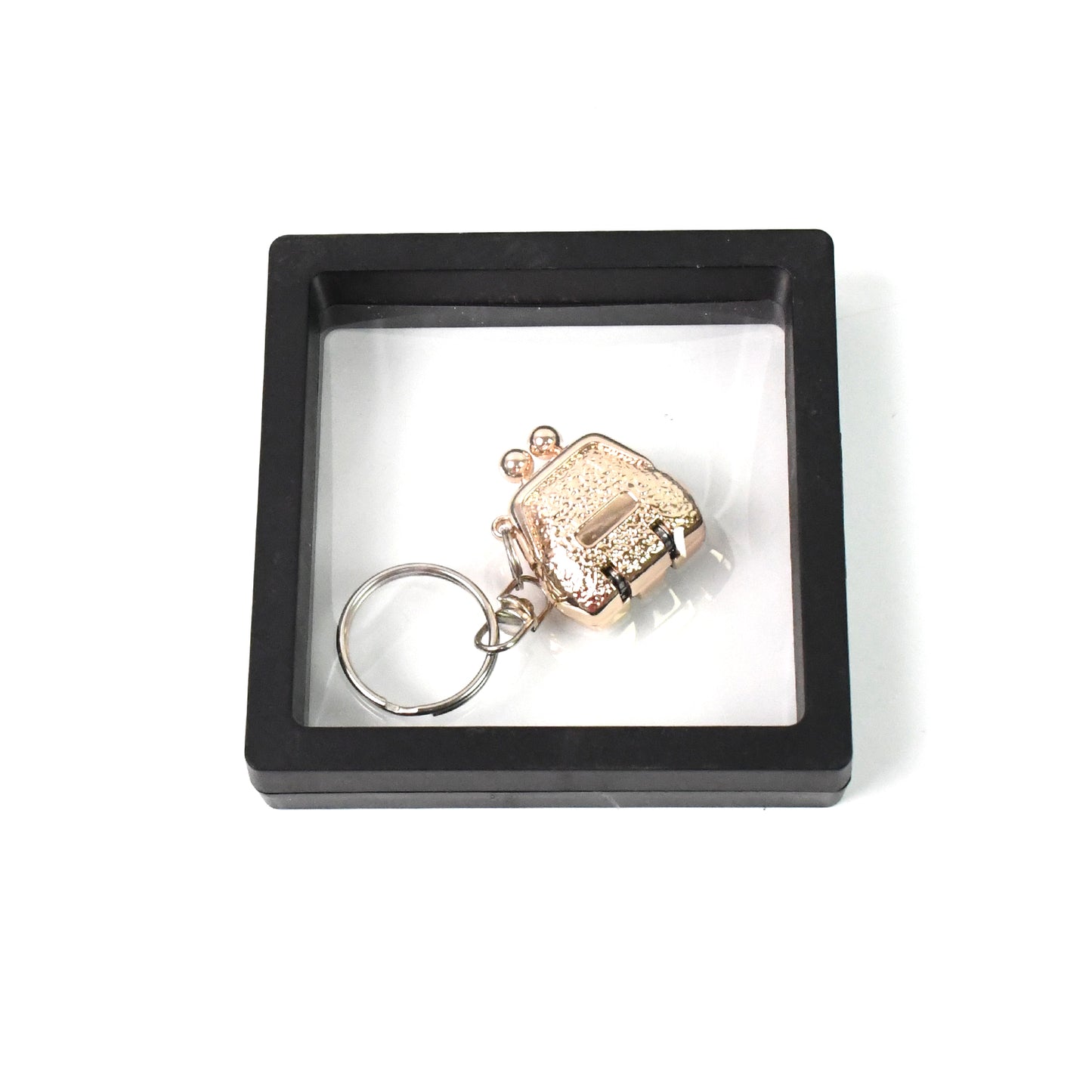 Wukusy nail clipper keychain with 3D floating frame display case, compact health care accessory in a set.