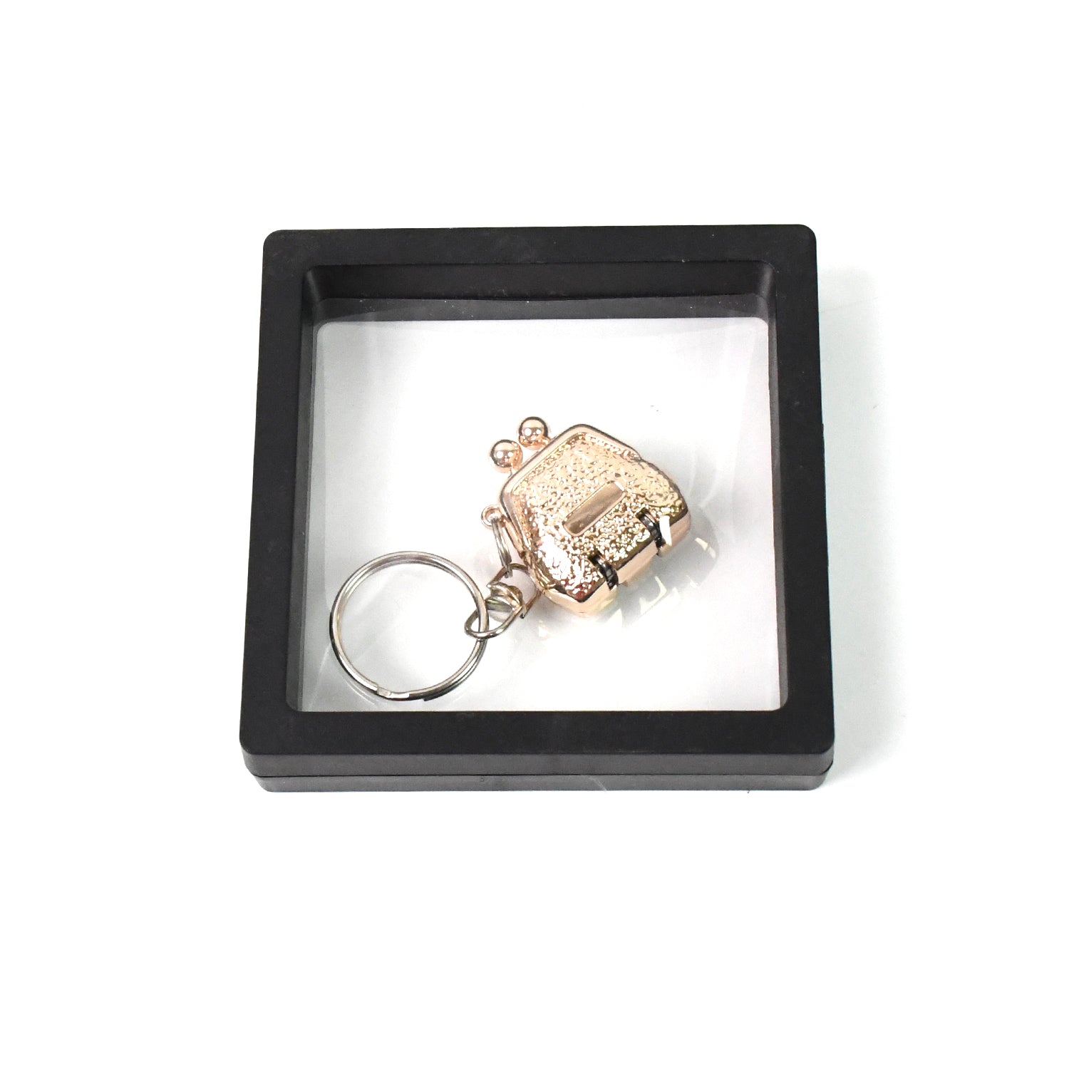 Wukusy nail clipper keychain with 3D floating frame display case, compact health care accessory in a set.