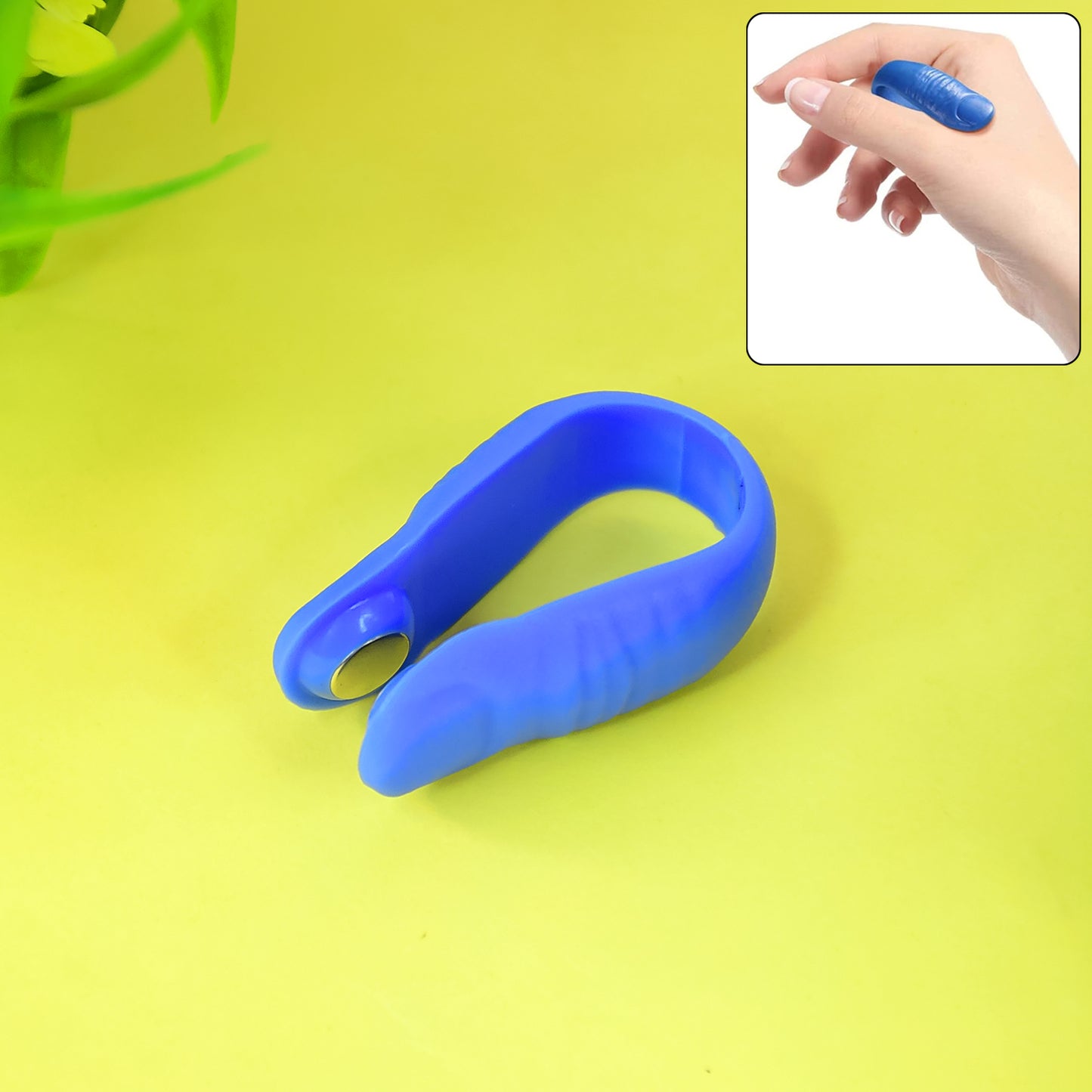 Plastic magnetic acupressure clip by Wukusy, used for health care and pain relief, shown in a close-up image.