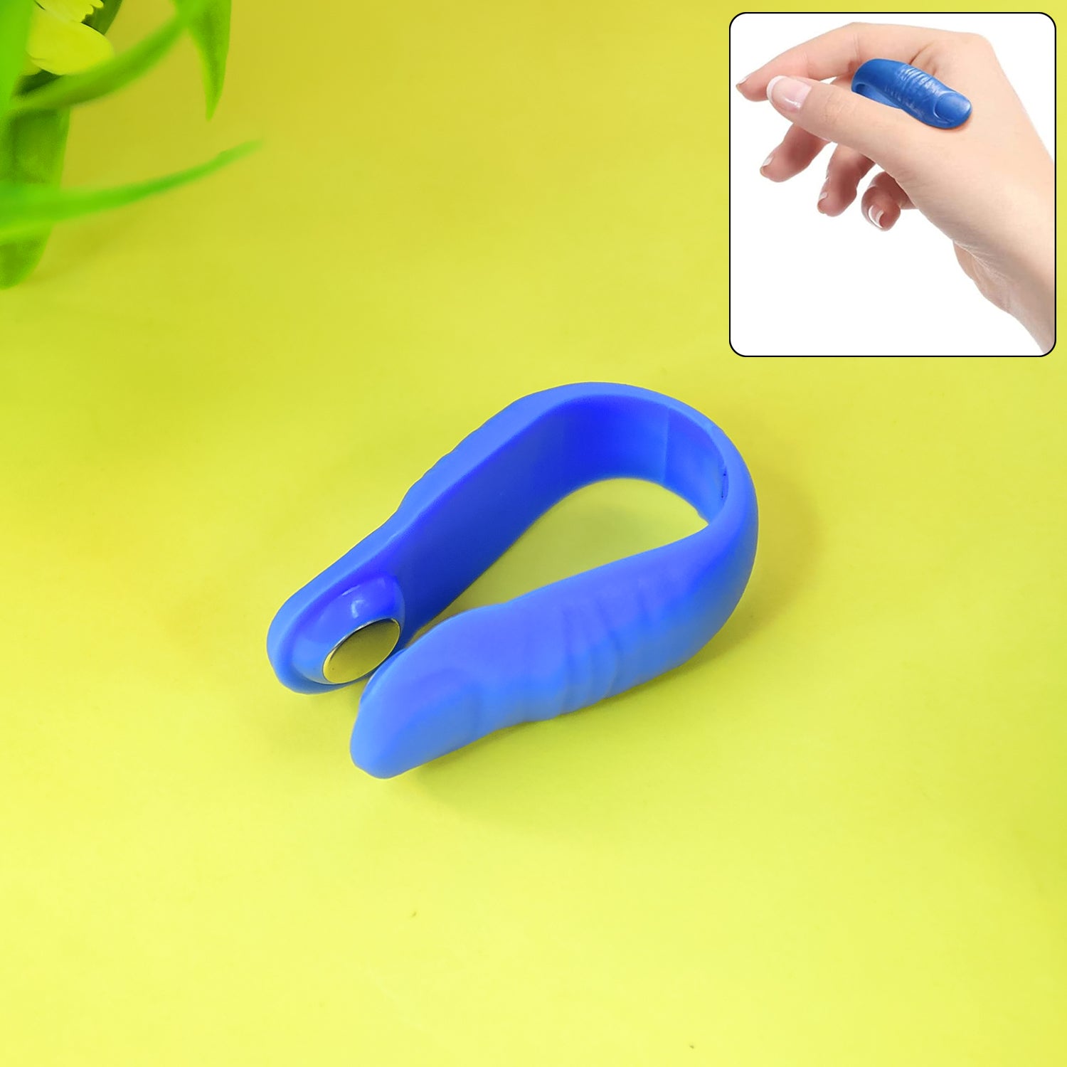 Plastic magnetic acupressure clip by Wukusy, used for health care and pain relief, shown in a close-up image.