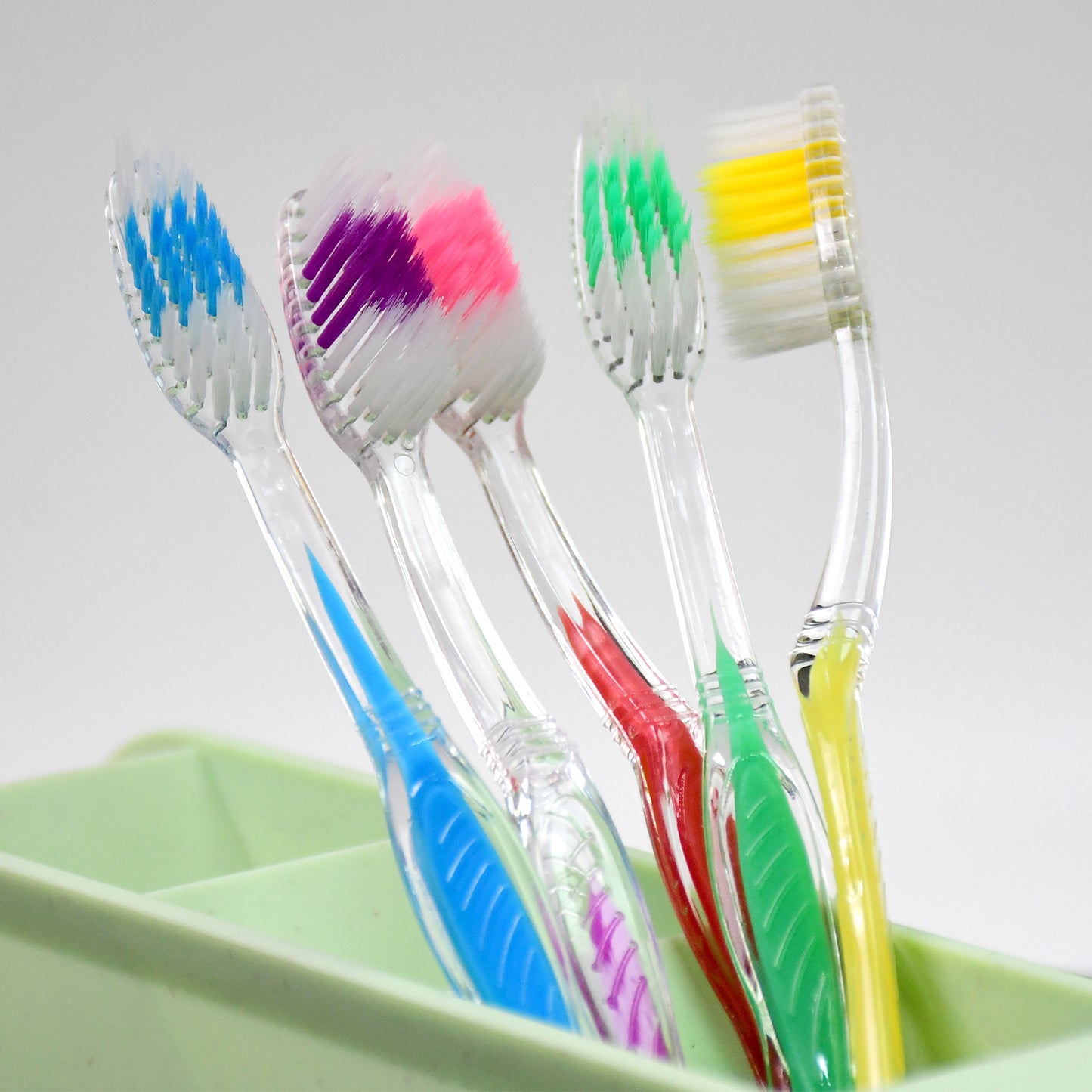Wukusy premium plastic toothbrush in mixed colors, designed for effective oral health care, with soft bristles for gentle cleaning.