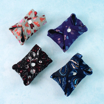 Set of four reusable cloth sanitary pads for women by Wukusy, health care product designed for comfort and eco-friendly use.