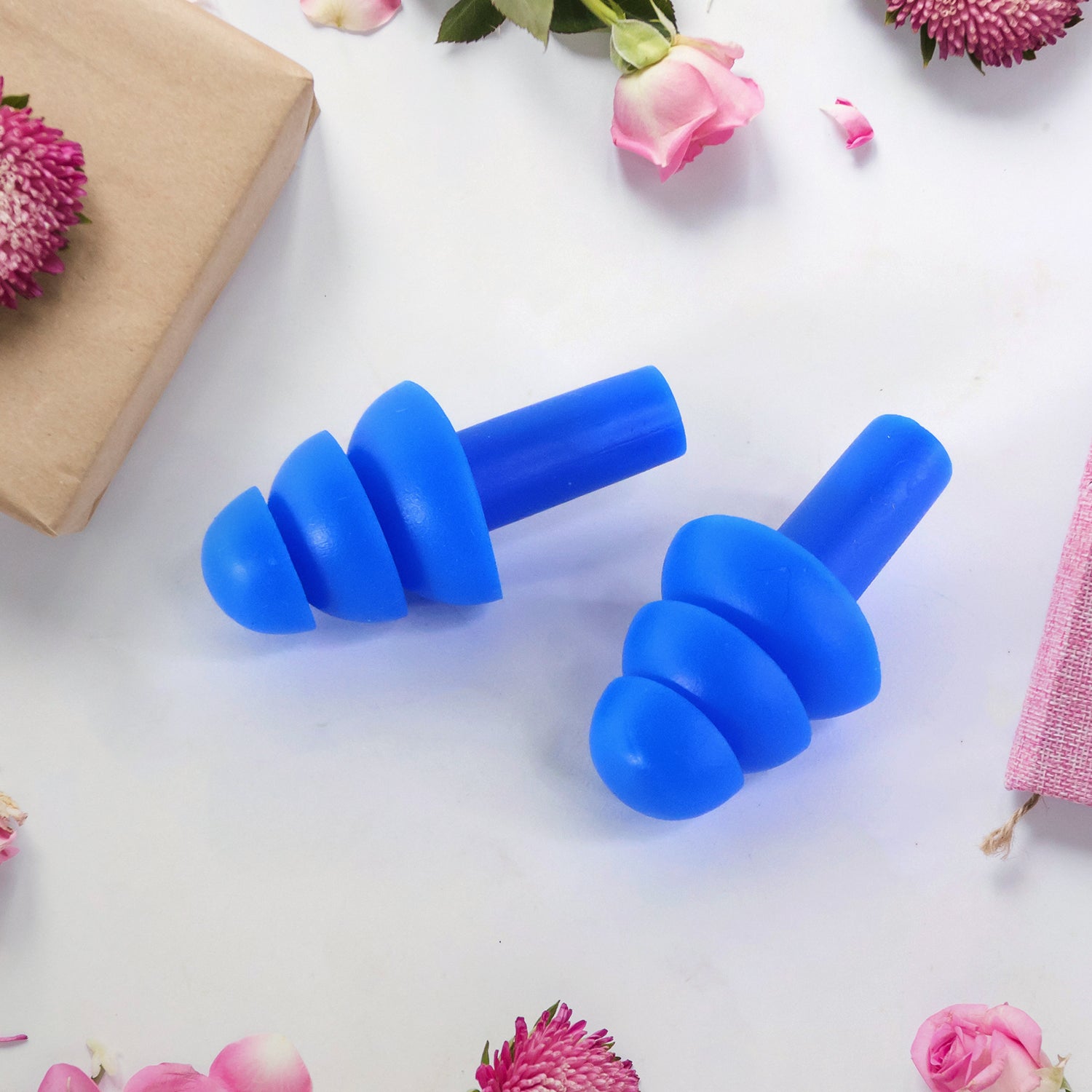 Set of Wukusy reusable silicone swimming ear plugs for water protection and comfort during swimming activities.