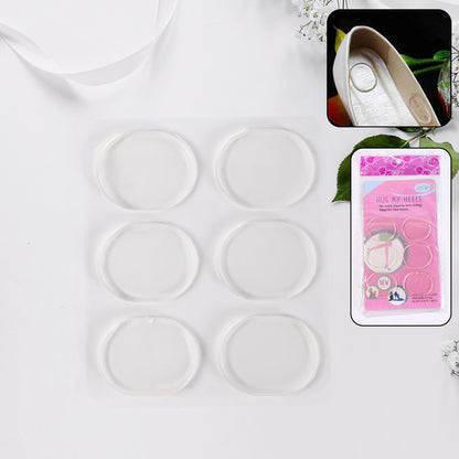 Pair of Wukusy silicone shoe insoles and heel pads for comfort and support, shown in a close-up image.