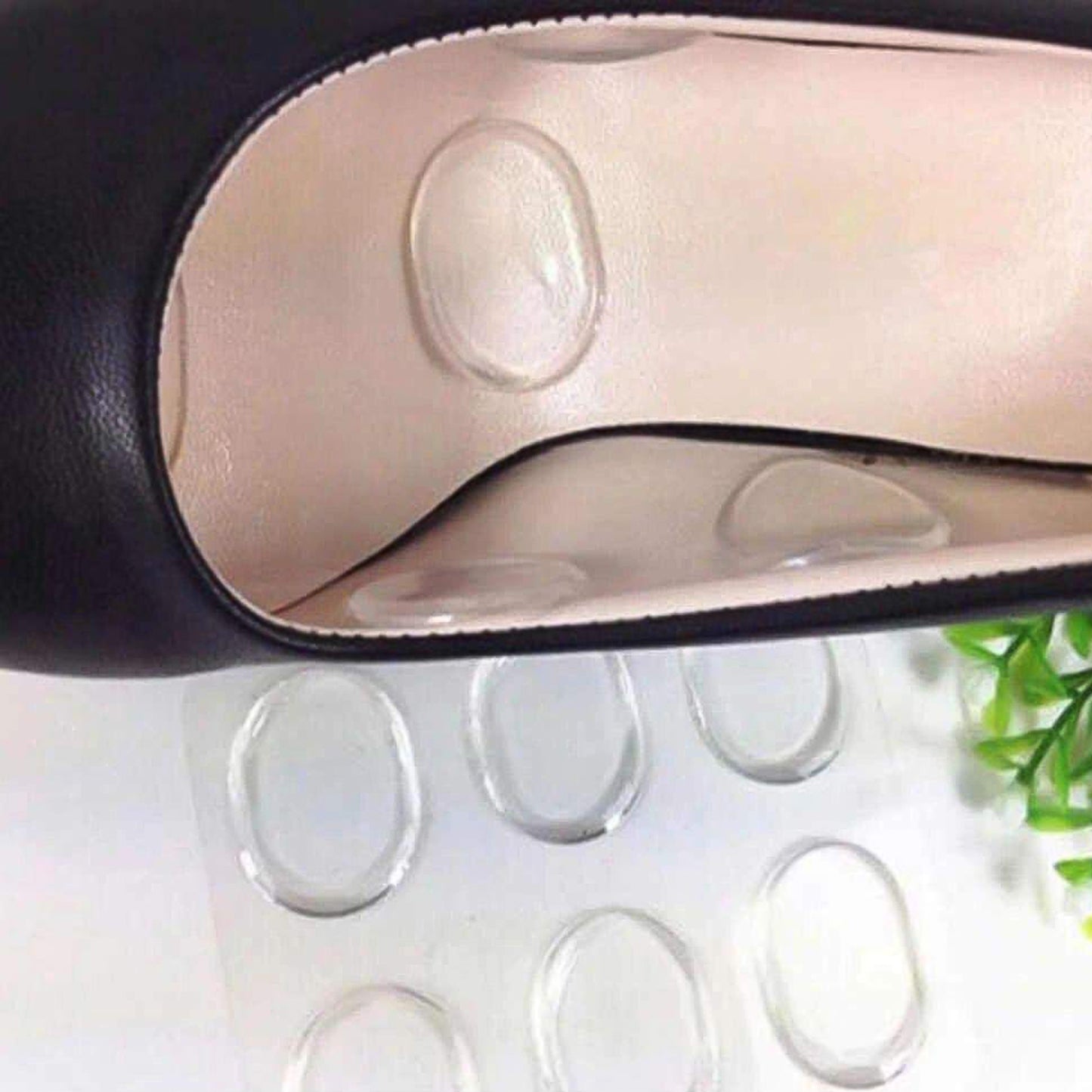 Pair of Wukusy silicone shoe insoles and heel pads for comfort and support in health care footwear.