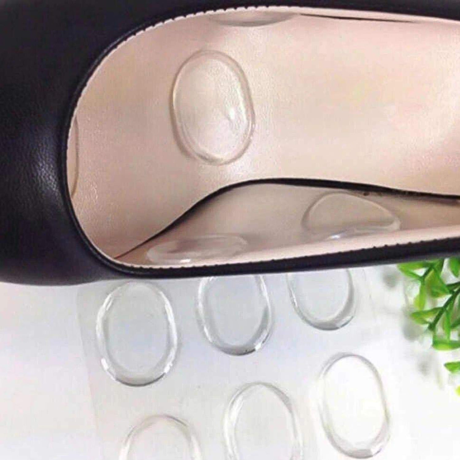 Pair of Wukusy silicone shoe insoles and heel pads for comfort and support in health care footwear.