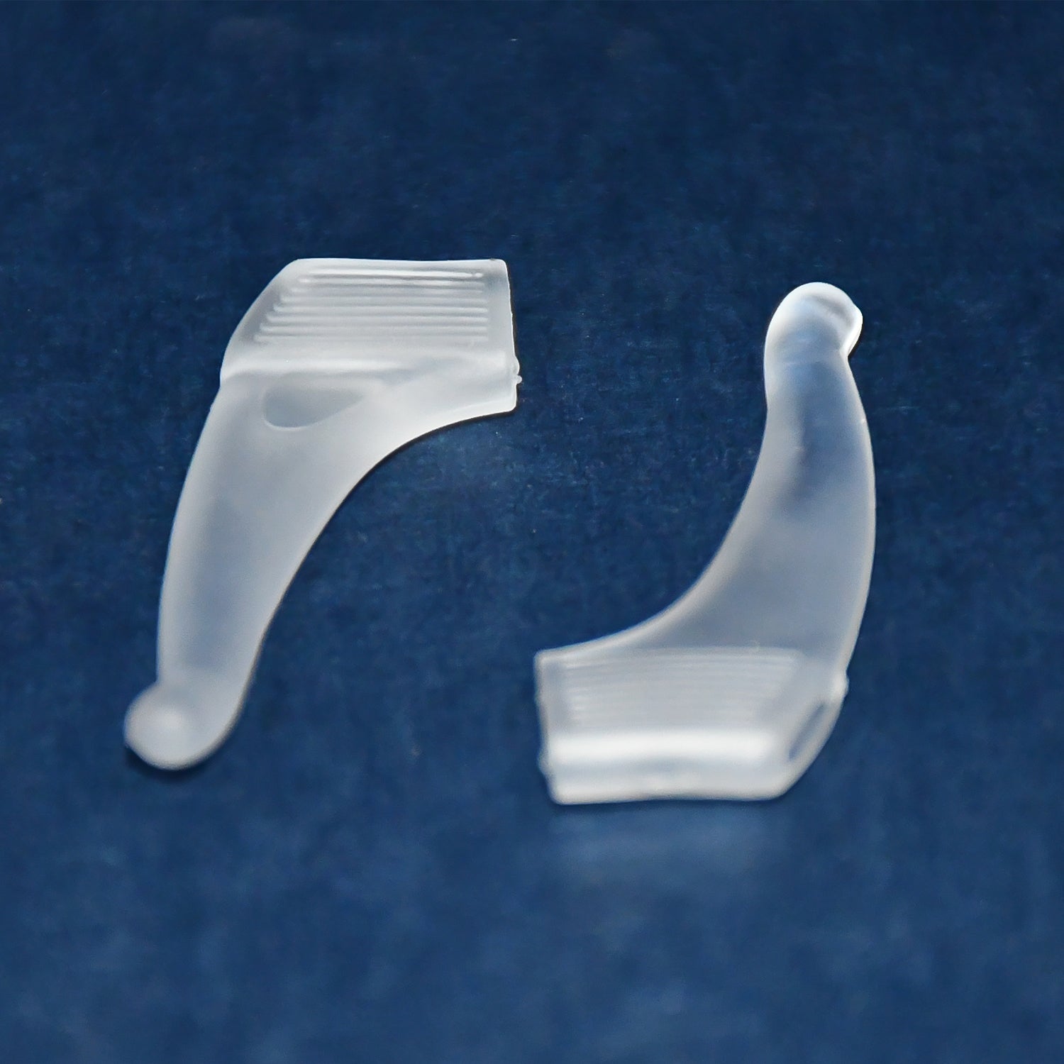 Pair of soft silicone glasses ear hooks by Wukusy, designed for anti-slip comfort on eyeglasses.