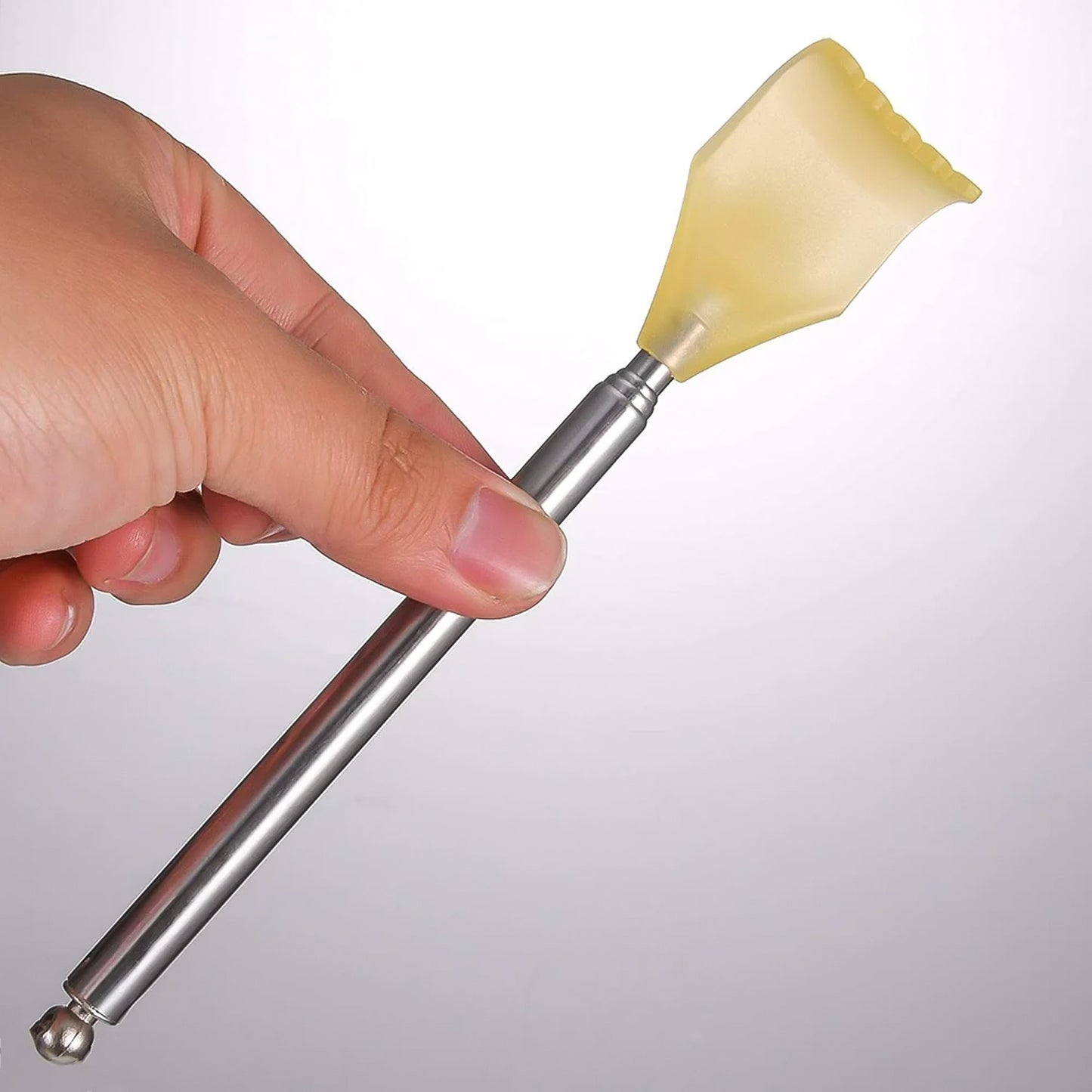 Wukusy telescopic back scratcher with plastic claw extends for easy reaching and skin scratching.