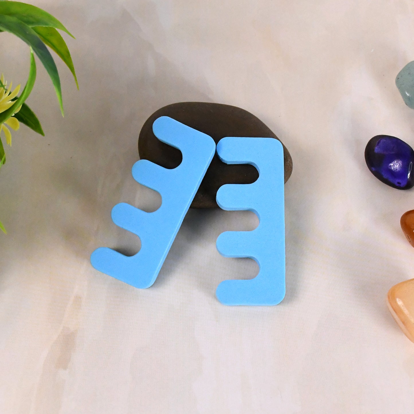 Wukusy health care toe separators and spacers made of sponge, designed to stretch toes and improve foot comfort.