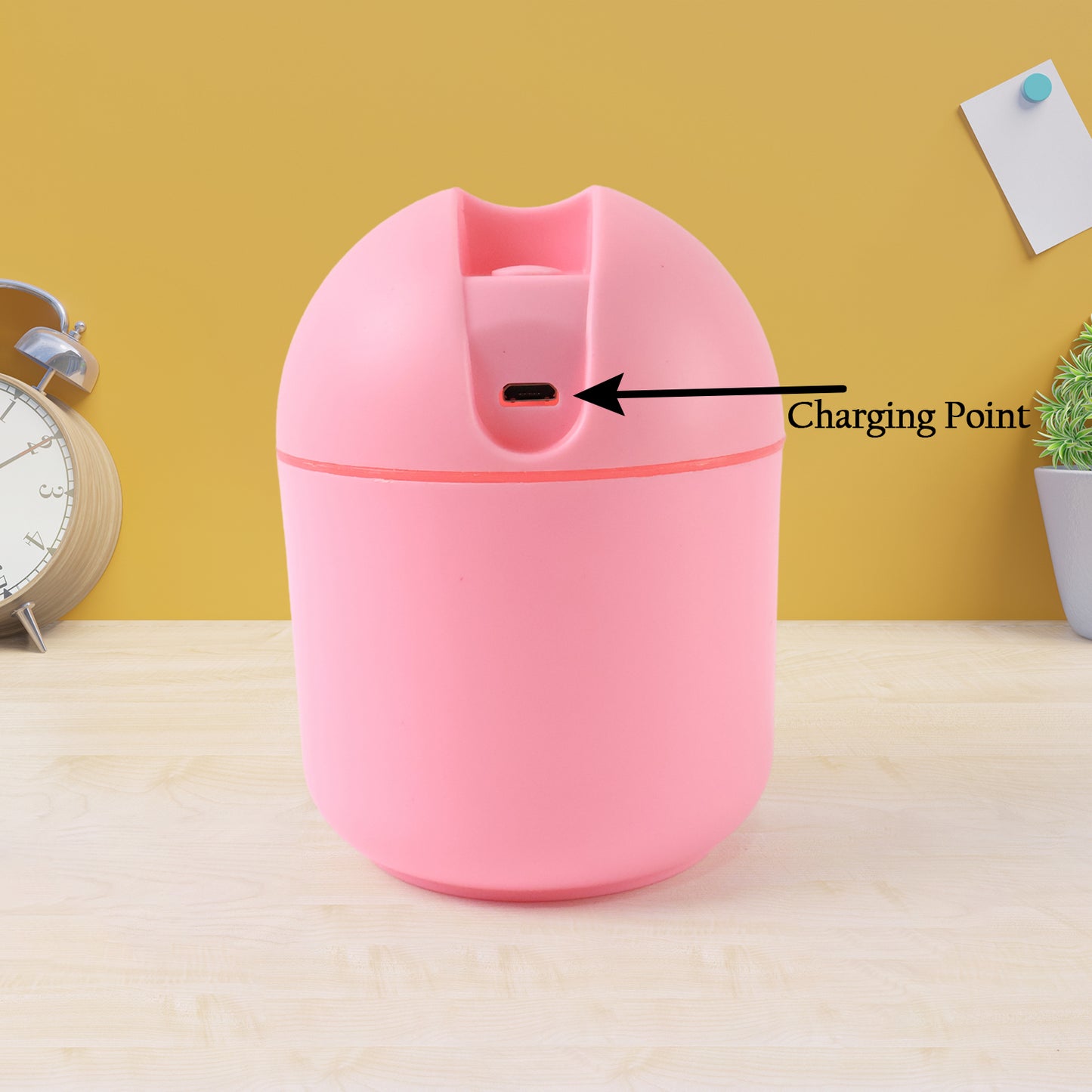 Wukusy USB mini air humidifier for home and office, compact health care device emitting mist on a white background.