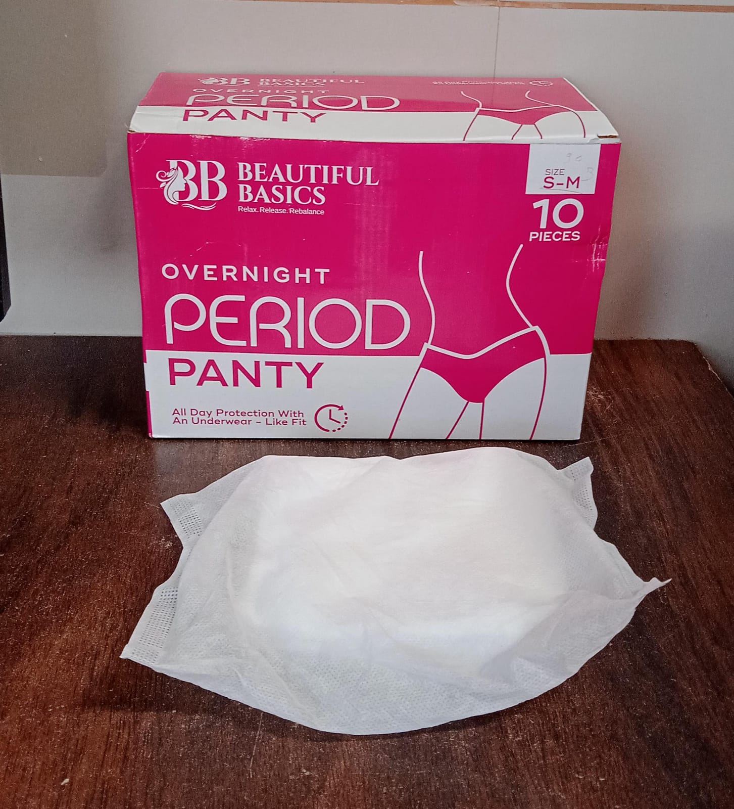 Wukusy women's emergency travel kit with seamless underwear, pantyliners, feminine hygiene sachets, and first period essentials.