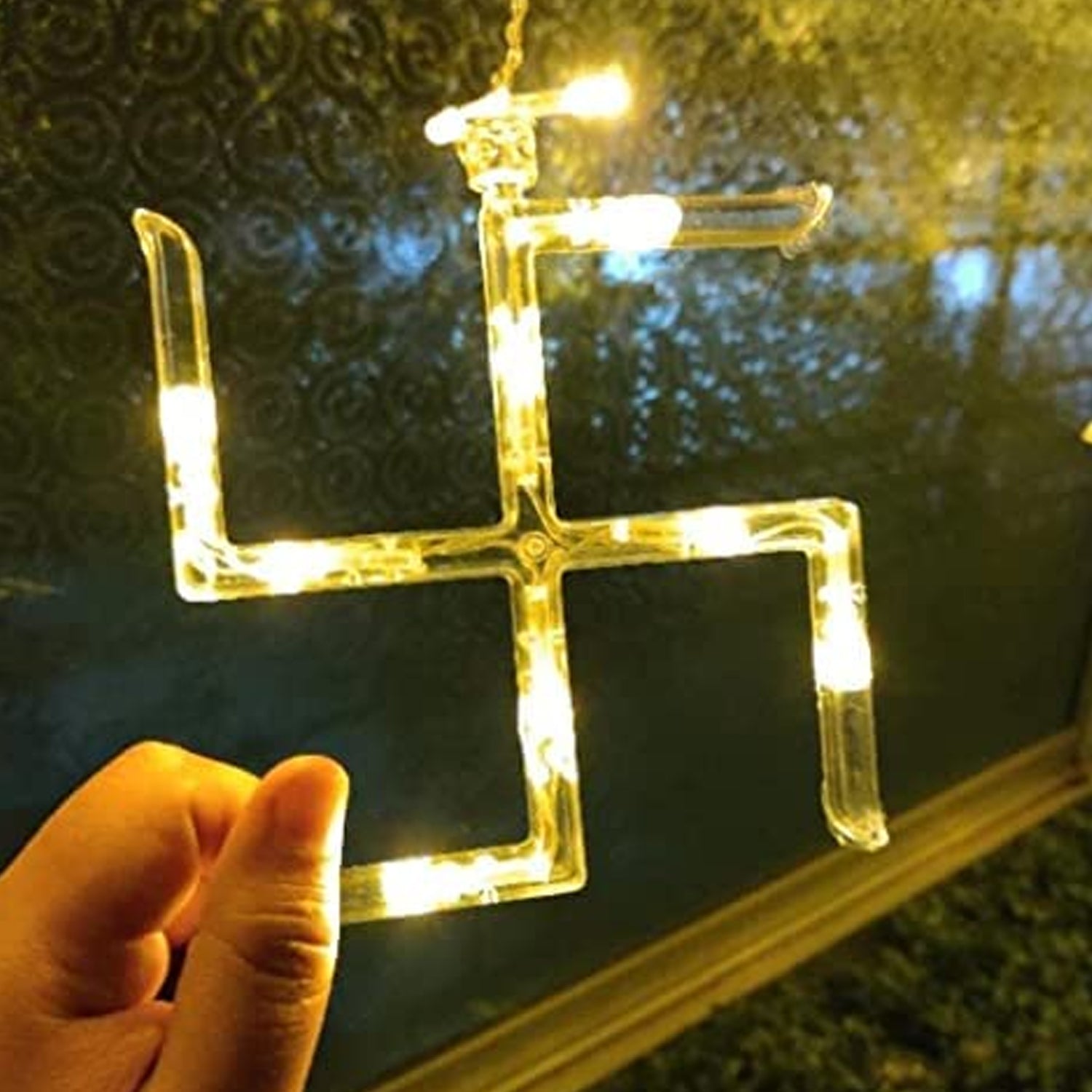 Wukusy Swastik Om decorative string lights with 12 hanging props, 138 LED bulbs for Diwali home decor, bedroom or balcony lighting.