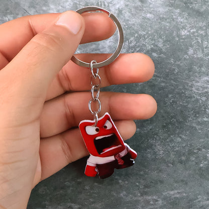 Animated character acrylic keychain from Wukusy, featuring a colorful home decor design, displayed on a plain background.