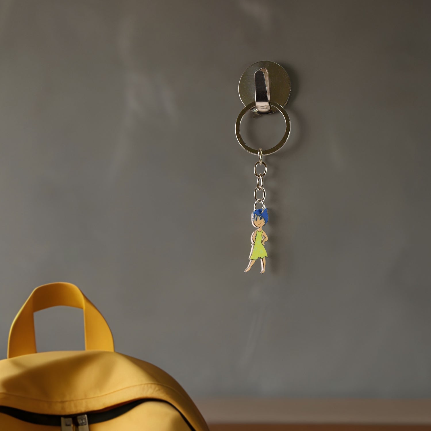 Wukusy cartoon character soft PVC keychain featuring a girl with hair, ideal for home decor or accessories.