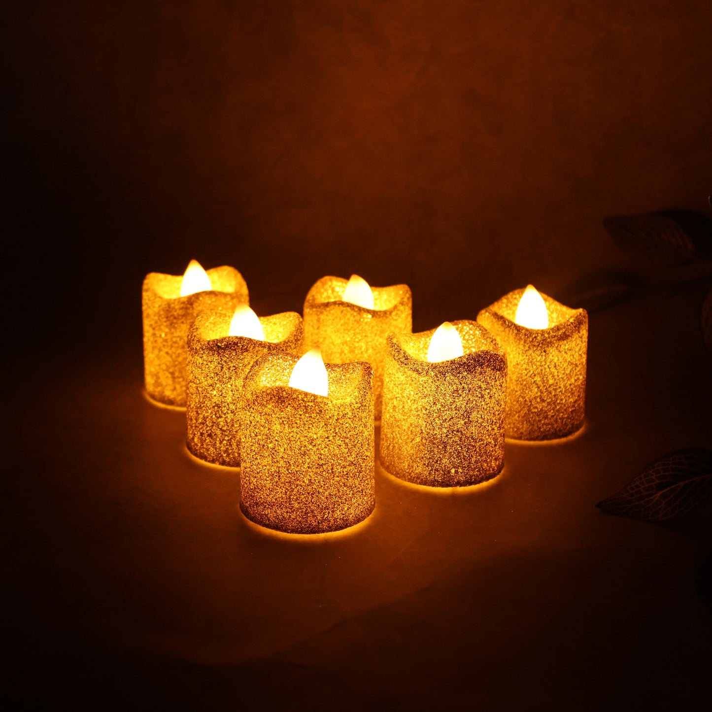 Set of six Wukusy Christmas premium glitter LED tealight candles for festive home decor with shimmering, decorative lighting.