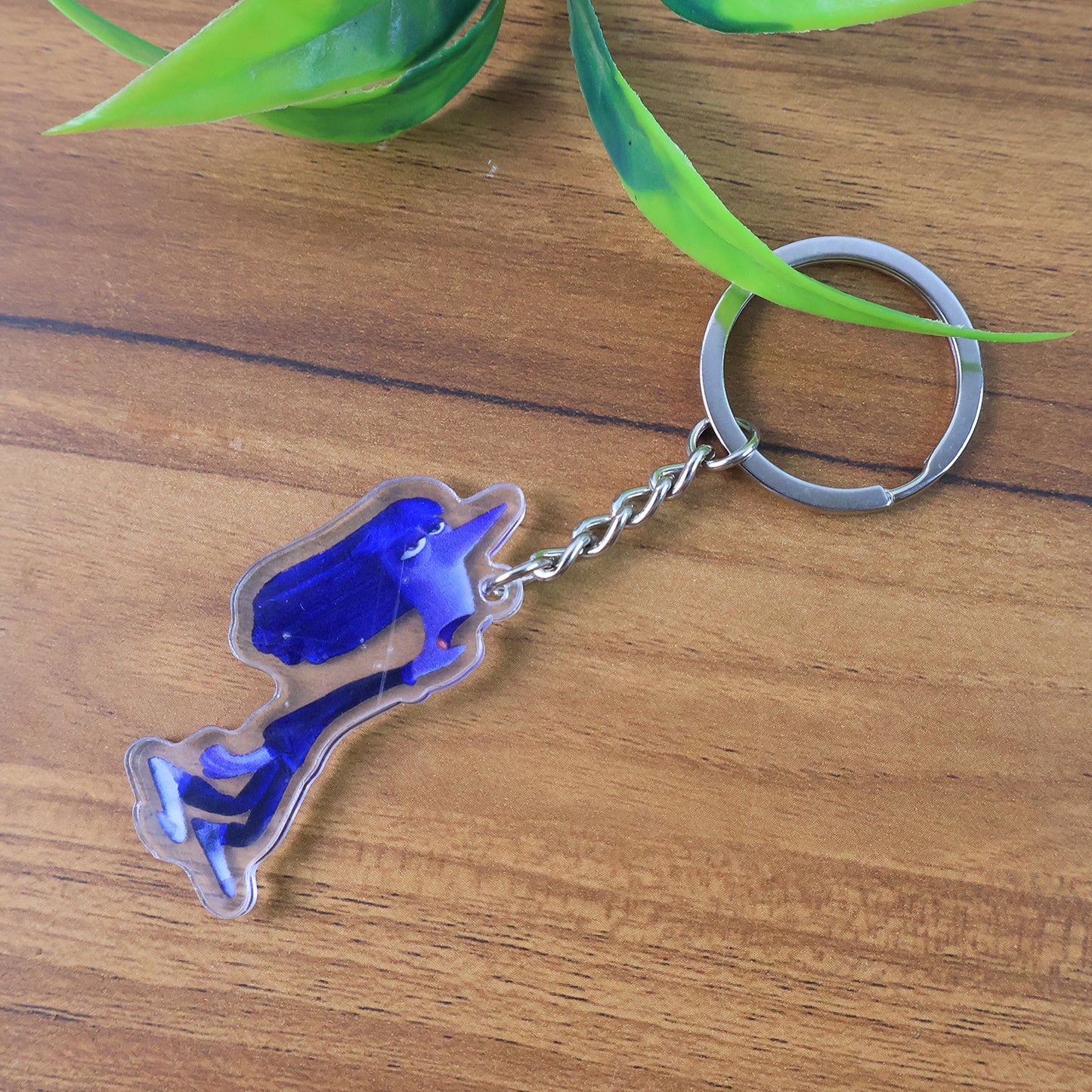 Wukusy cute cartoon character acrylic keychain for home decor, featuring a colorful, playful design on a clear acrylic surface.