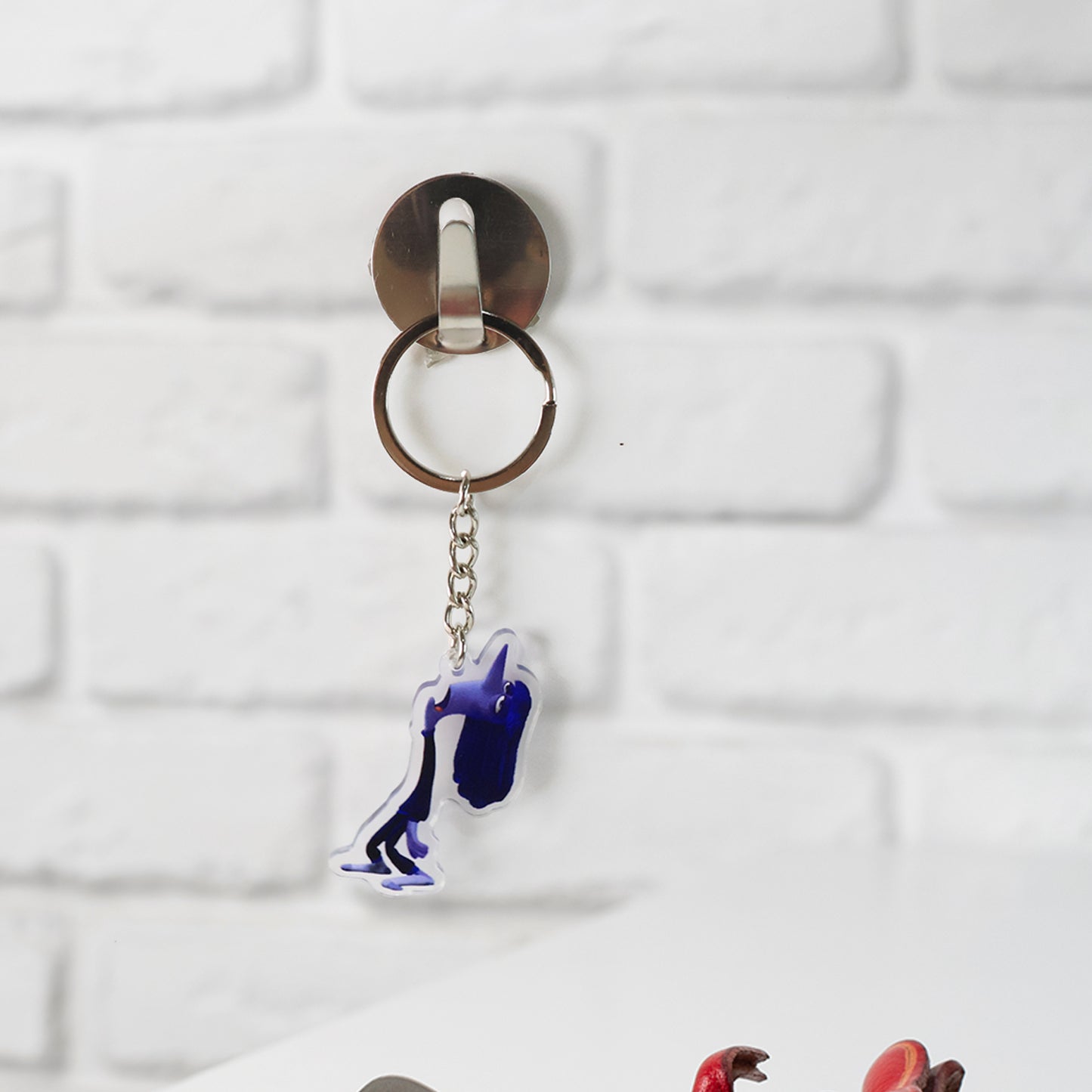 Cute cartoon character acrylic keychain by Wukusy, featuring vibrant colors and playful design, ideal for home decor accessories.