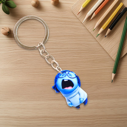 Wukusy cute cartoon girl keychain for kids' bags and stationery, featuring colorful character design and playful details.