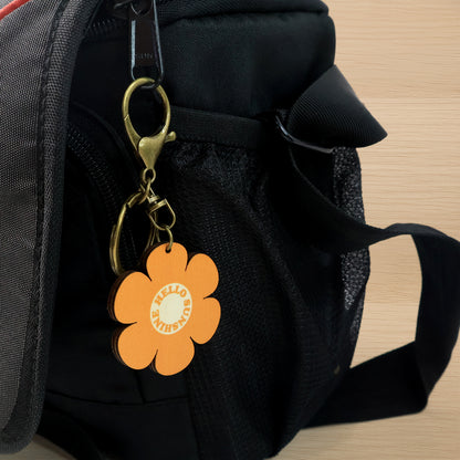 Cute flower-shaped keychain by Wukusy, featuring colorful mixed designs, perfect for home decor or accessories.