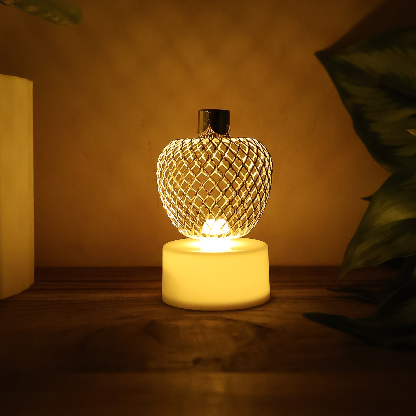 Set of 12 decorative apple-shaped LED tealight candles by Wukusy for home decor.