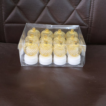 Set of 12 decorative apple-shaped LED tealight candles by Wukusy for home decor, with warm glowing light and realistic apple design.