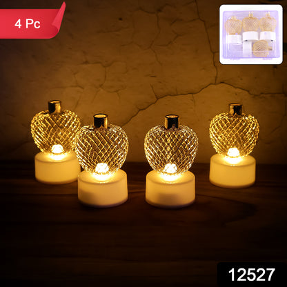 Set of four decorative apple-shaped LED tealight candles for home decor by Wukusy, ideal for ambient lighting.