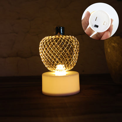 Set of four decorative apple-shaped LED tealight candles by Wukusy for home decor, featuring warm, flickering light and charming design.
