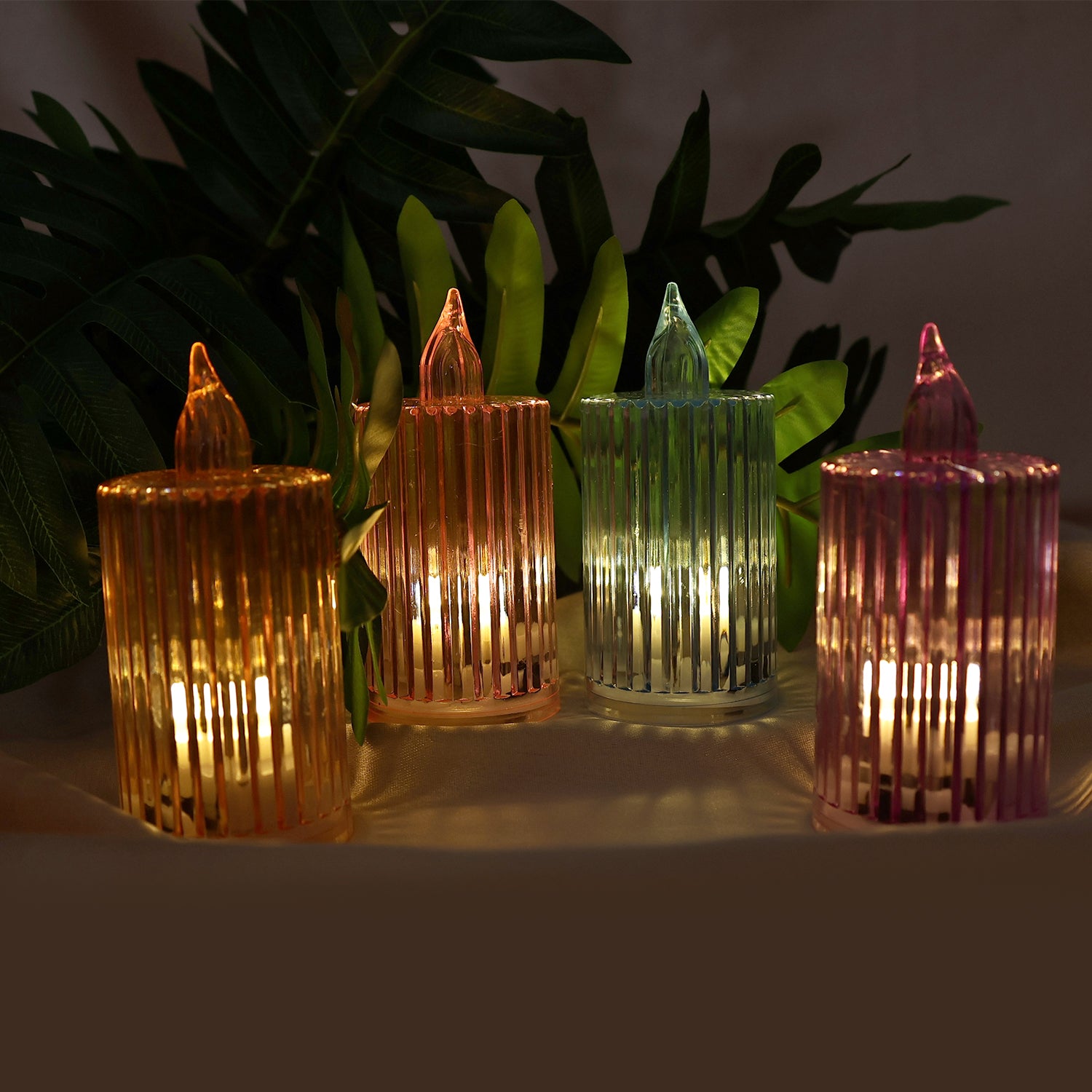 Set of 24 decorative flameless electronic LED candles from Wukusy for home decor, featuring realistic flickering candle flames.