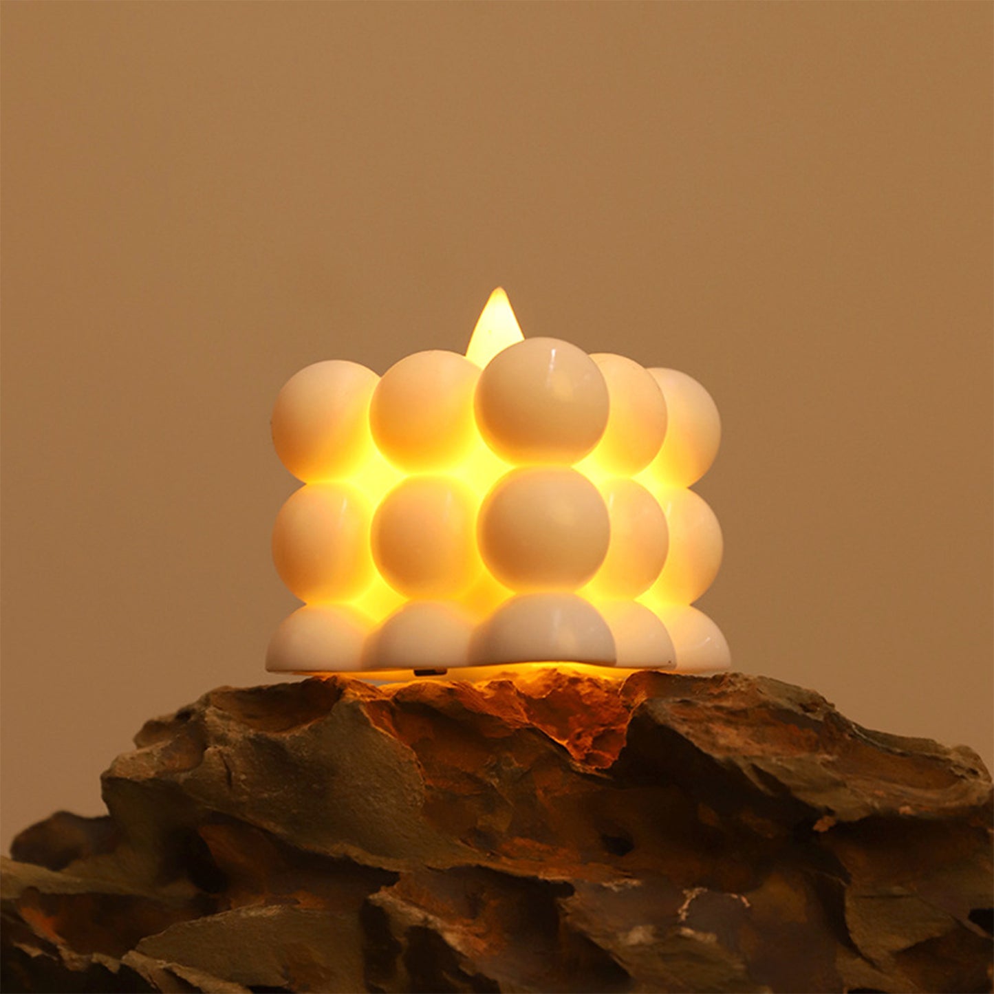 Six decorative LED bubble candles from Wukusy, home decor set with glowing, textured candle shapes for ambient lighting.