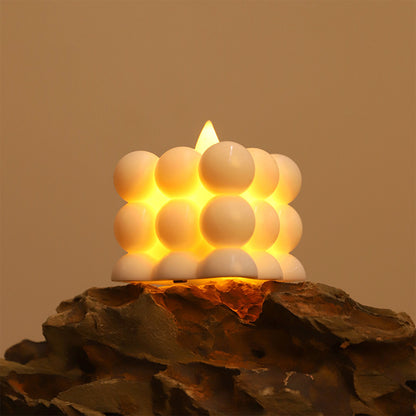 Six decorative LED bubble candles from Wukusy, home decor set with glowing, textured candle shapes for ambient lighting.
