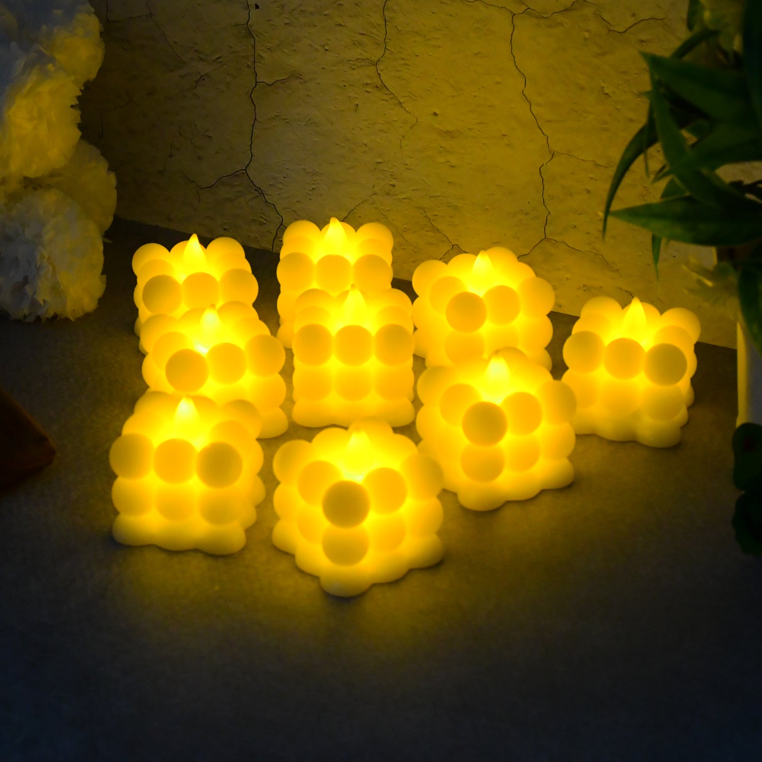 Set of nine Wukusy decorative LED bubble candles for home decor, featuring glowing, bubble-inspired designs.