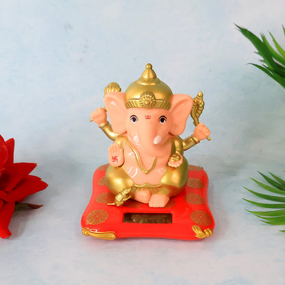 Decorative medium Lord Ganesh idol statue with solar-powered base, ideal for home decor, by Wukusy.
