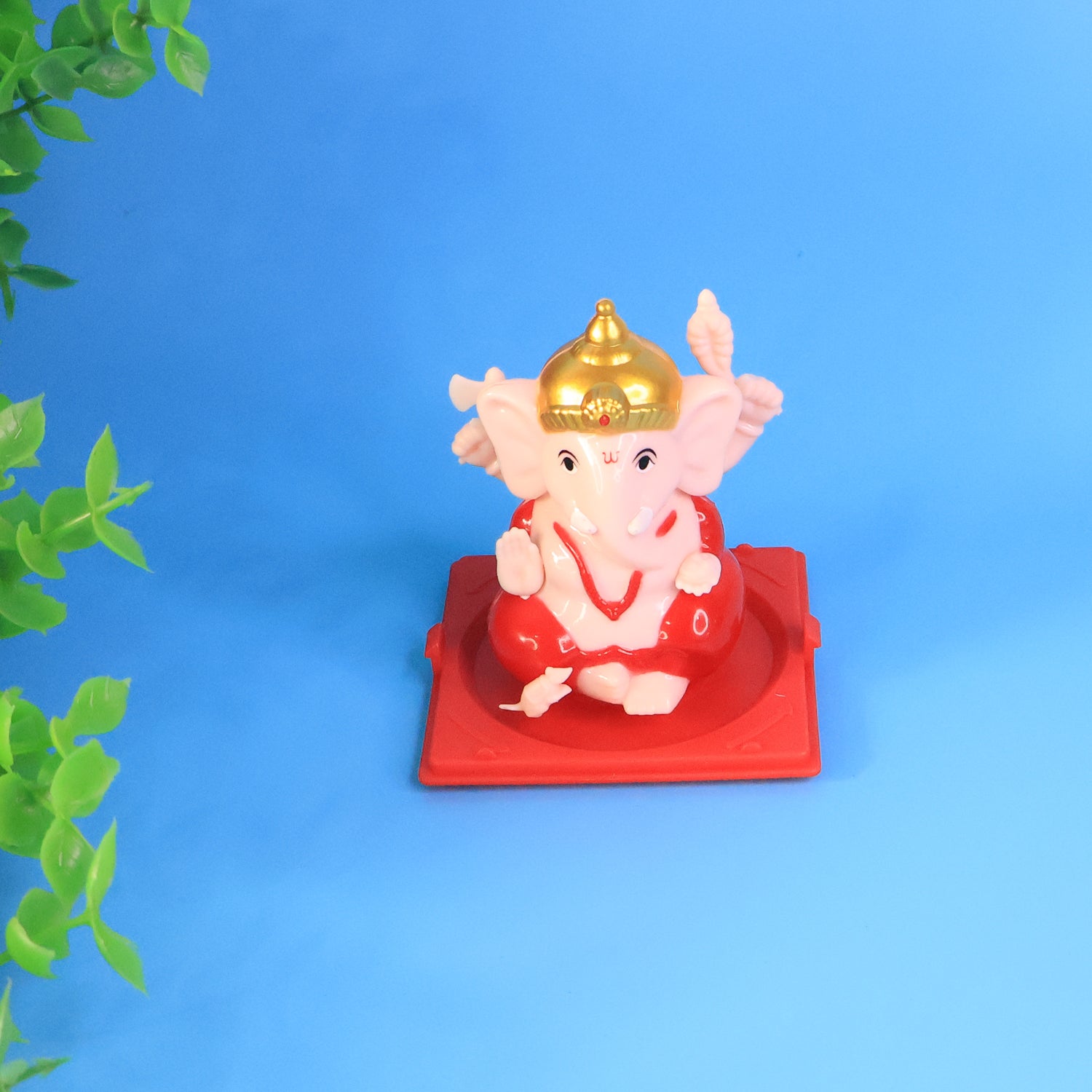Small Lord Ganesh idol in transparent display case, ideal for home decor, by Wukusy.