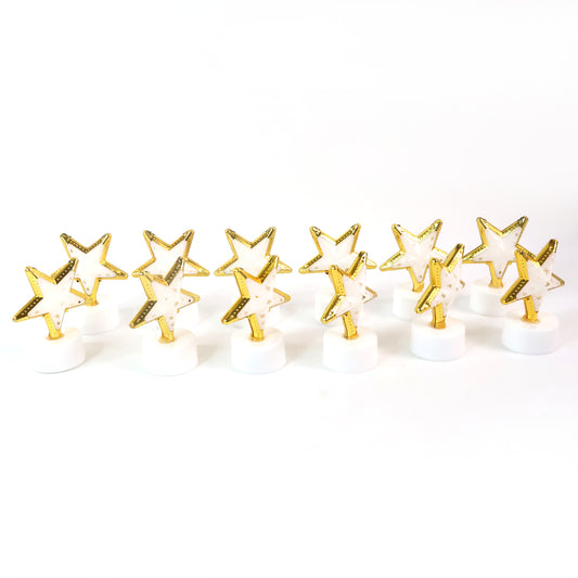 Set of 12 Wukusy star-shaped flameless LED candles for home decor, realistic flickering light, decorative indoor lighting.