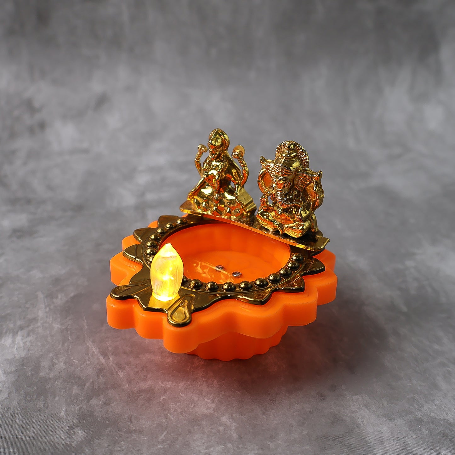 Decorative Wukusy Water Sensor LED Diya for home decor, featuring traditional design and glowing light, single piece.