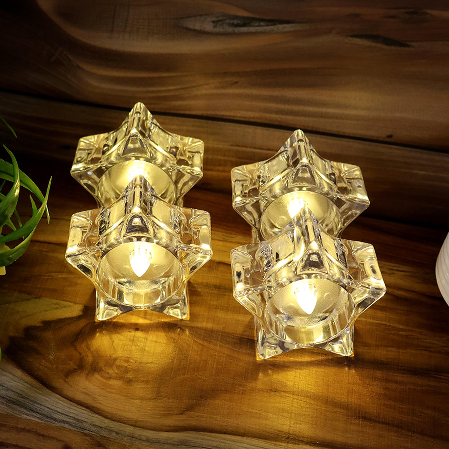 Set of four Wukusy flameless star-shaped LED candles for home decor, with warm, flickering light for cozy ambiance.