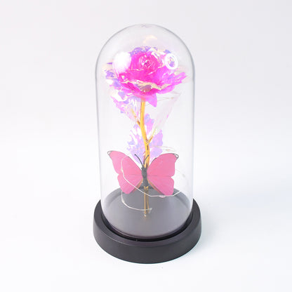 Wukusy LED decorative rose with butterfly inside a transparent plastic dome, home decor piece, battery not included.