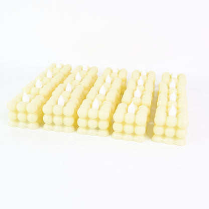 Set of 24 Wukusy LED flameless cube decorative candles for home decor, with warm, flickering light and realistic candle appearance.