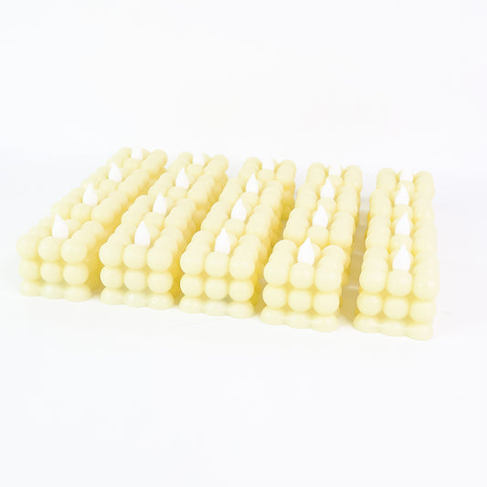 Set of 24 Wukusy LED flameless cube decorative candles for home decor, with warm, flickering light and realistic candle appearance.